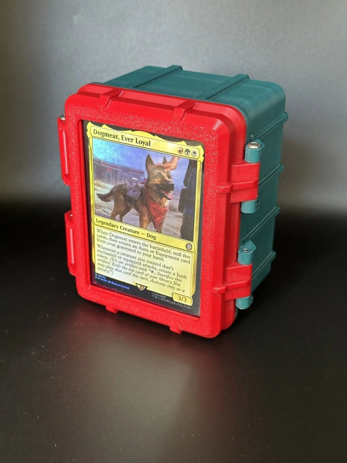 Rugged Commander deck box with commander card displayed behind a locking toploader