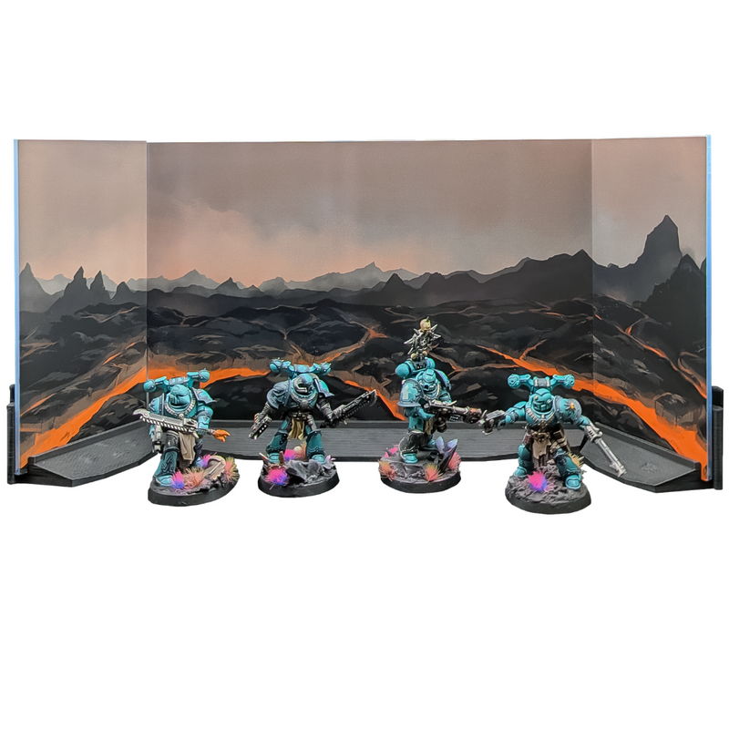 Acrylic diorama backdrop with volcanic lava scenery and side panels behind four painted miniatures on a shelf